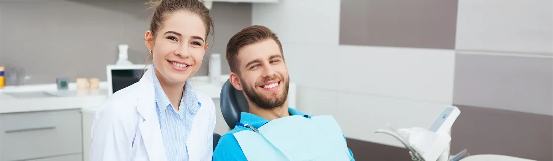 Dentist Tuscaloosa AL Dentist and Patient Smiling photograph of female Dentist and male Patient Smiling