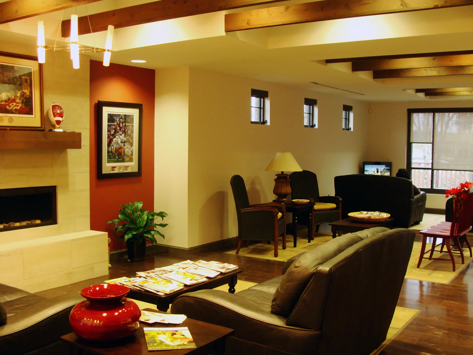 Davis Dental welcoming lobby and waiting area featuring a fireplace and comfortable seating with wooden floors